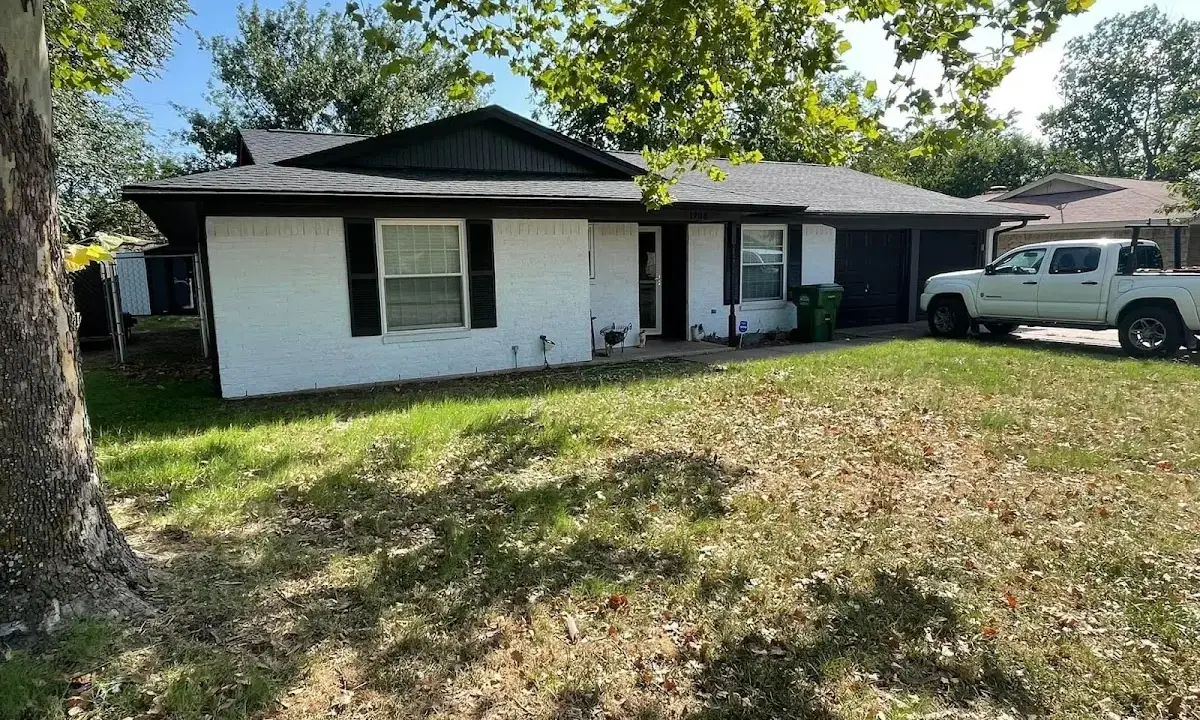 Professional roofing crew working on a residential roof in Summit View